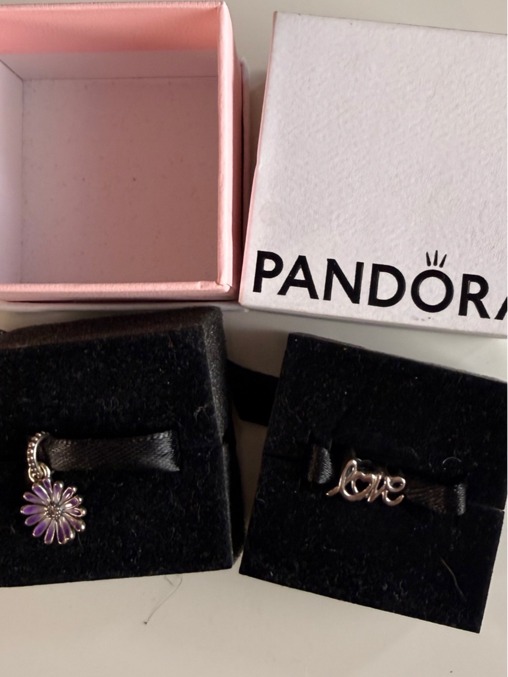 2 Pandora Silver charms. ‘Love' Script Charm and purple flower charm